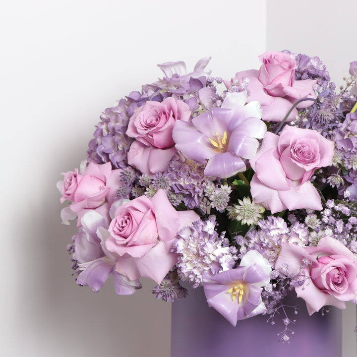 Flower box with purple roses